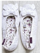 Deane & White white lace ballerina slippers with a floral print lining and bows