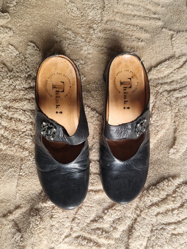 Black think mules unusual - mules.,