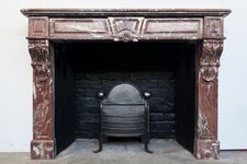 French marble fireplace surround in rouge royal marble. Empire period