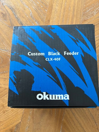 Okuma custom black feeder reel - okuma,