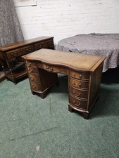 ANTIQUE/REPRODUCTIO FLAMED MAHOGANY SERPENTINE LEATHER TOPPED DESK BY REPRODUX
