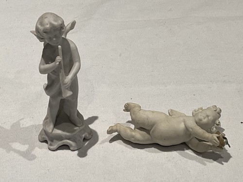 Two small porcelain cherub - two,