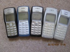 Five Nokia 1100 phone and Three chargers