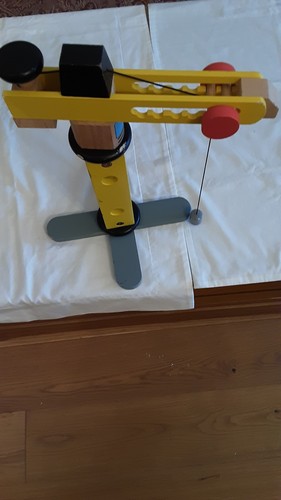 Large yellow wooden dock crane - yellow,