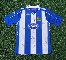Signed Wigan Athletic