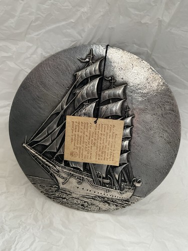 Pewter wall plaque depicting - wall,