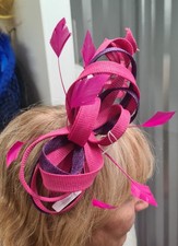 Stunning bright pink twizzle wedding hat/fascinator