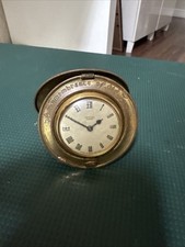 This is a Smiths Empire novelty clock with a inscription.