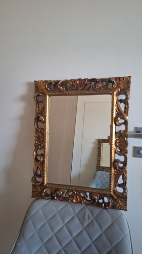 Wall mirror a carved - mirror, in