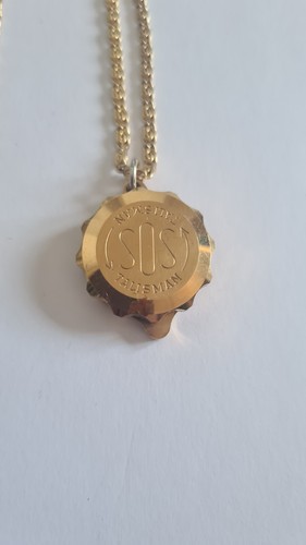 Gold tone sos talisman - tone,
