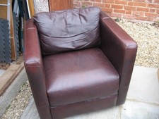 Comfortable brown leather/leatherette armchair