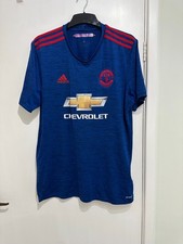 Blue Adidas sport top size L. Manchester United badge and Chevrolet logo.