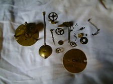 Brass cogs and pendulum for a french clock