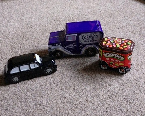 Three collectible vehicle tins - three,