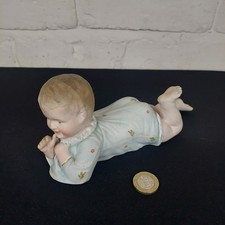 Bisque Porcelain Piano Baby