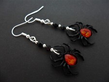A PAIR OF   DANGLY BLACK AND