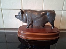 Royal Doulton Vietnamese Pot Bellied Pig Figurine on a Wooden Plinth DA189