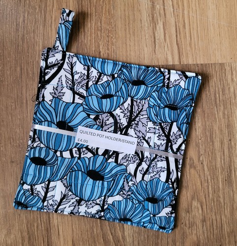 Handmade quilted pot - holder, or
