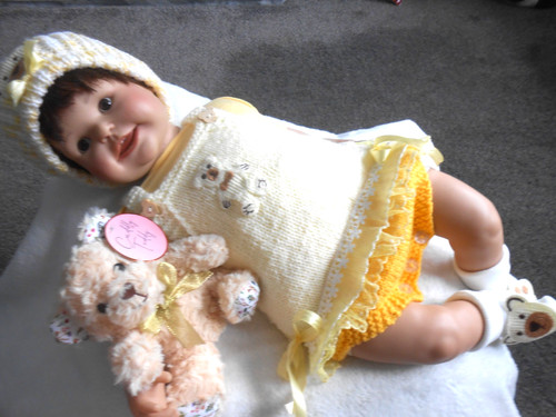 Hand knitted lemon teddy - hand,