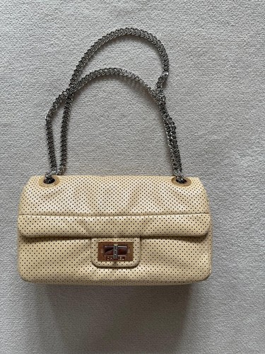 Chanel perforated drill flap - chanel,