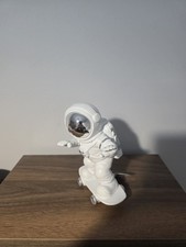 Skateboarding Astronaut Figure