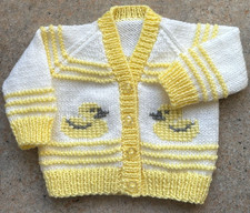 New hand knit cardigan for baby 0-3 months,  lemon/white.  Yellow duck motifs.  