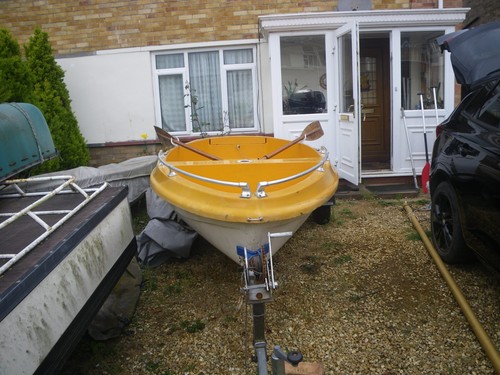 Skipper sailing dinghy with - 14,