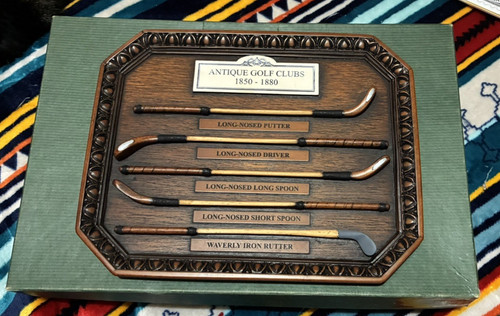 Miniature antique golf clubs