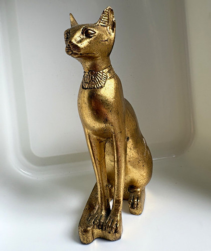 Gold tone metal sitting - sitting, cat