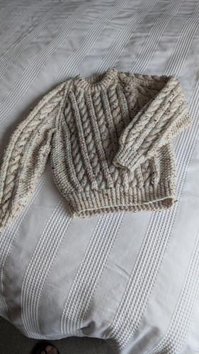 Child hand knitted aran - hand,