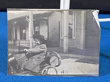 Child Riding Very Old Toy