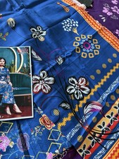 Unstitched Kinza Fabrics Slub Khaddar 3piece suit in vibrant blue floral print.