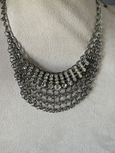 Silver tone rhinestone and