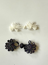 2 frog fasteners in black and