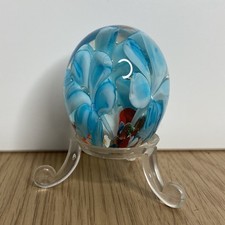 Paperweight glass egg shape Blue flower in middle around Red, White With Stand