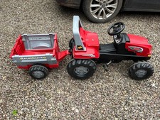 Red, pedal, sit on tractor and trailer made by Rolly Toys