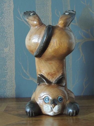 Carved wooden cat handstanding - cat,