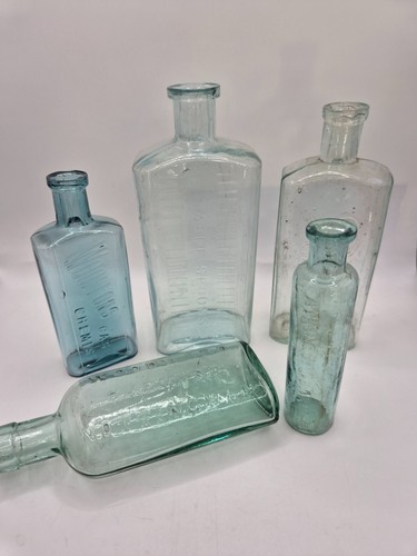 Old embossed chemist - embossed, bottles