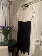 Laura Ashley Jump suit, cream top, black bottom, invisable zip. Good quality 
