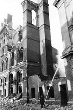 Fireman hoses down the smoking remains of a building in Southwark - Old Photo