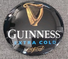A New Guinness Extra Cold, Round, 8cm In Circumference, Frog Eyed T.bar Badge