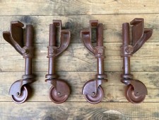 ANTIQUE METAL CASTORS WITH