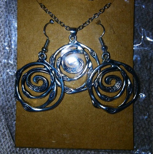 Silver tone swirl spiral - tone,