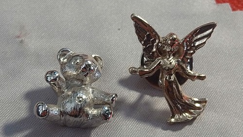 Two silver tone pin brooches - two,