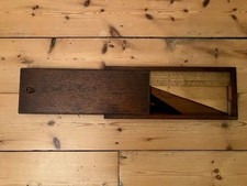 Wooden set square and ruler by Elliott Bros, Strand in sliding top mahogany box.