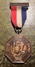 1935 medal King George V & Queen Mary Silver Jubilee medal named M. Huyton rear