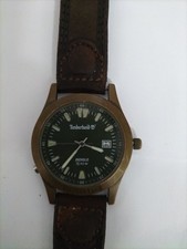 TIMBERLAND VINTAGE MENS WATCH 50M, BRASS METAL INDIGO WITH BROWN LEATHER STRAP.