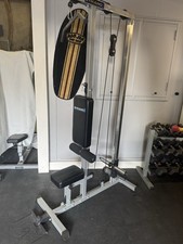 Body Solid Lat Pull Down Machine And Low Level Rowing Machine.