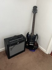 Epiphone Black 6 string Guitar And Amp