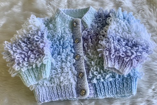 Hand knitted baby loopy - hand,